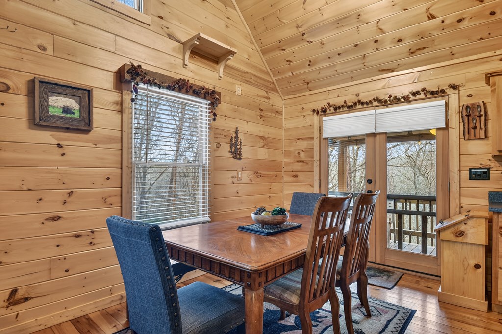 111 Roaring Creek Road Epworth, GA 30541 - Photo 36 of 63 a view of a dining room with furniture and wooden floor