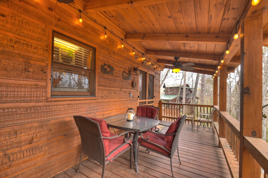 111 Roaring Creek Road Epworth, GA 30541 - Photo 47 of 63 a dining room with furniture and wooden floor