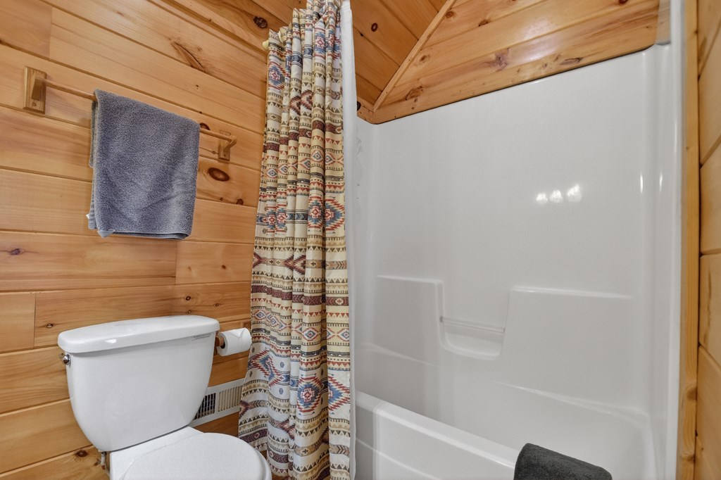 111 Roaring Creek Road Epworth, GA 30541 - Photo 48 of 63 a bathroom with a toilet and a shower