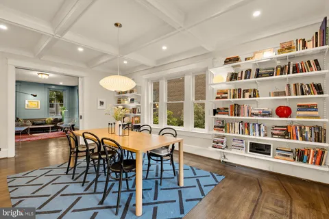 a large kitchen with a table and chairs in it