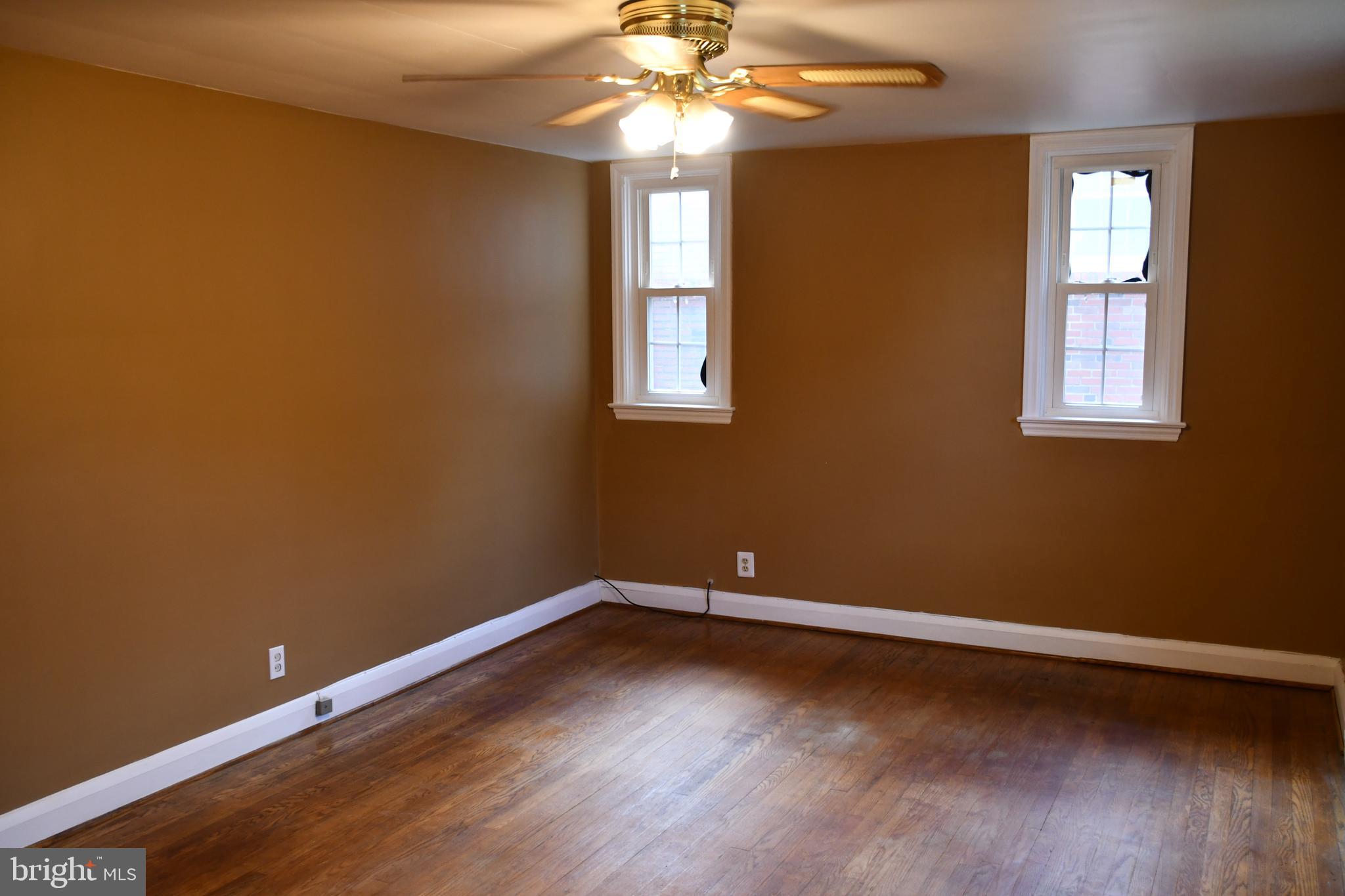615 Overbrook Road Baltimore, MD 21212 - Photo 20 of 48 a view of an empty room with wooden floor and a window