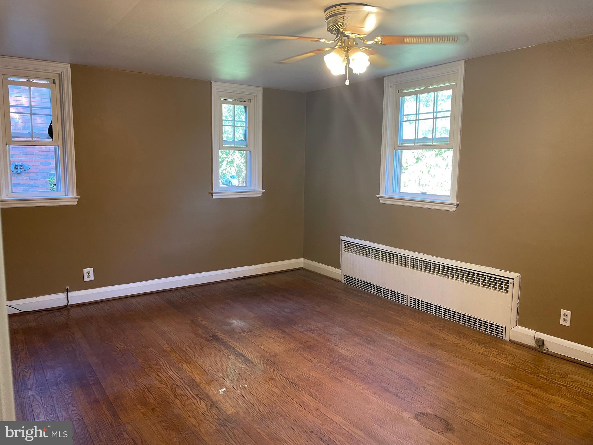 615 Overbrook Road Baltimore, MD 21212 - Photo 23 of 48 a view of an empty room with wooden floor and a window
