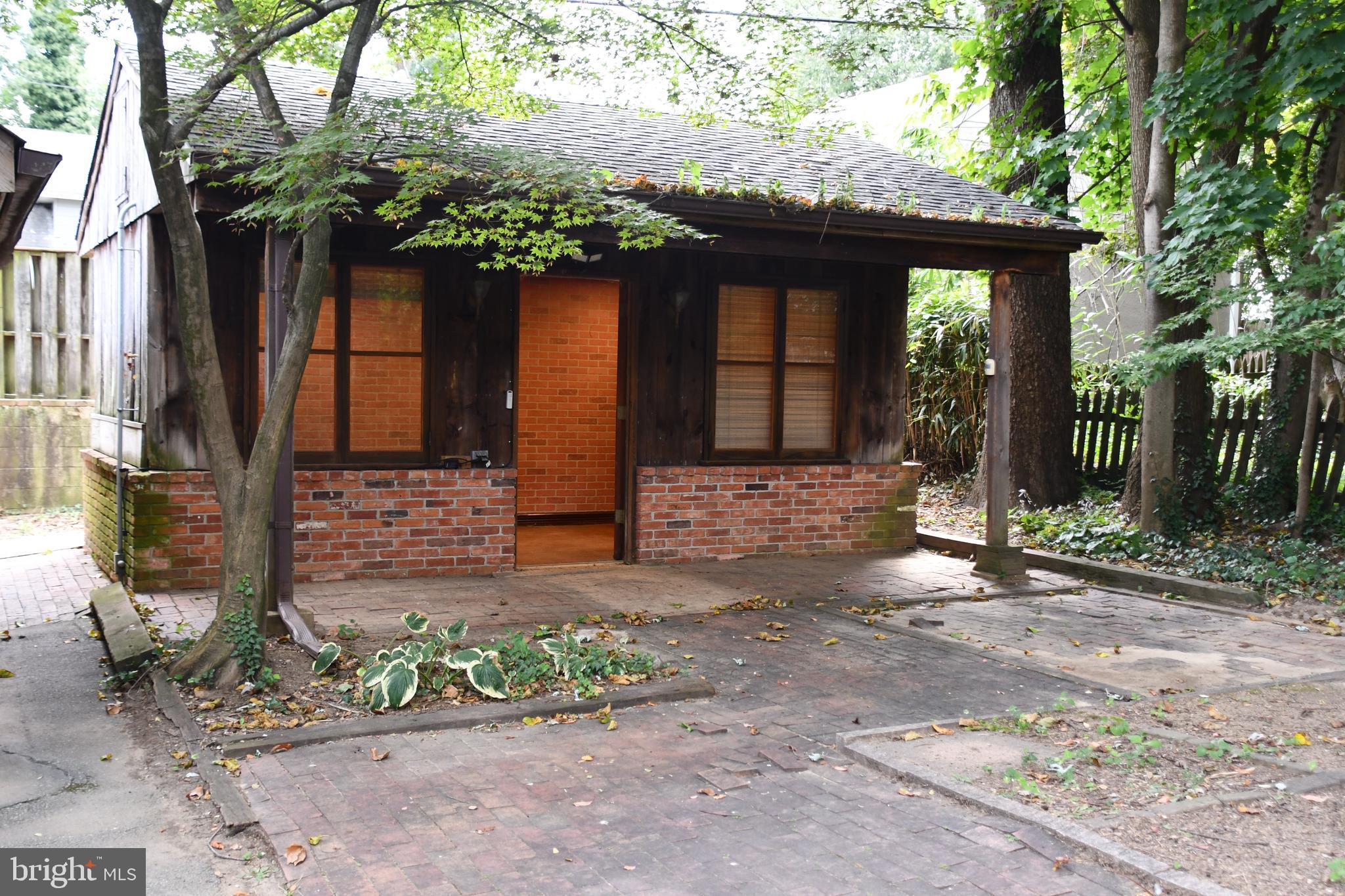 615 Overbrook Road Baltimore, MD 21212 - Photo 26 of 48 a front view of a house with garden