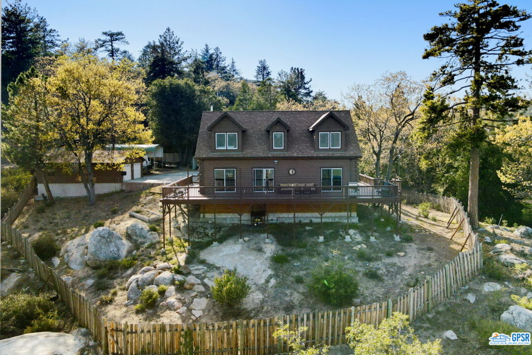 53305 Big Rock Drive Idyllwild, CA 92549 - Photo 2 of 67 a front view of a house with a yard