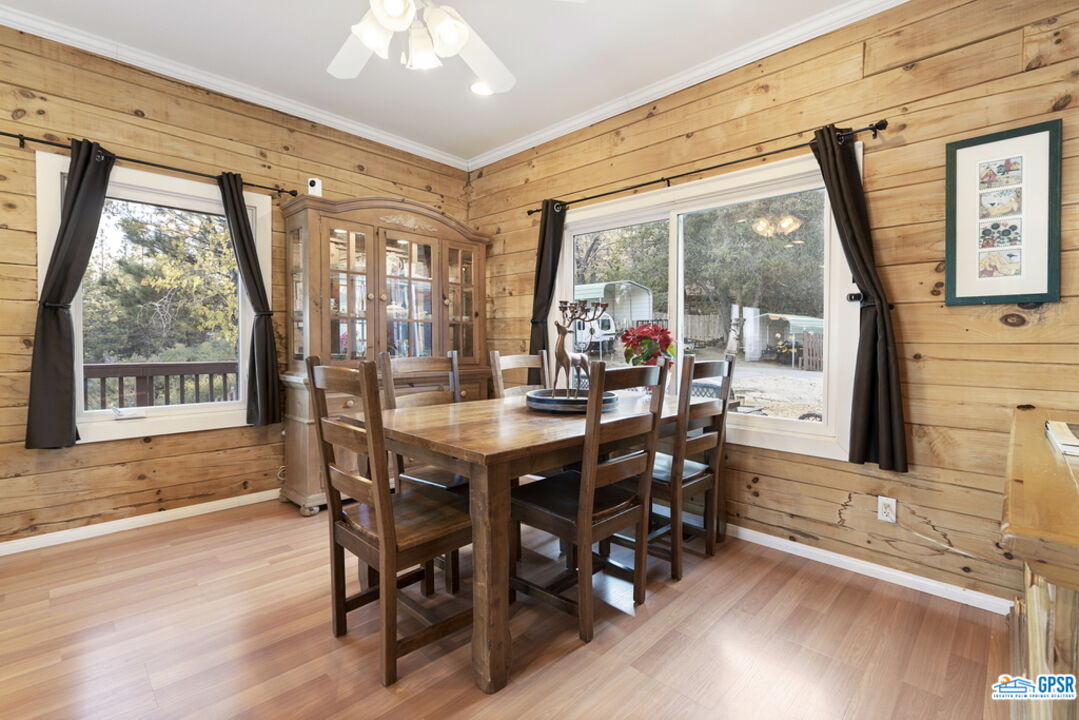 53305 Big Rock Drive Idyllwild, CA 92549 - Photo 25 of 67 a dining room with furniture a chandelier and wooden floor