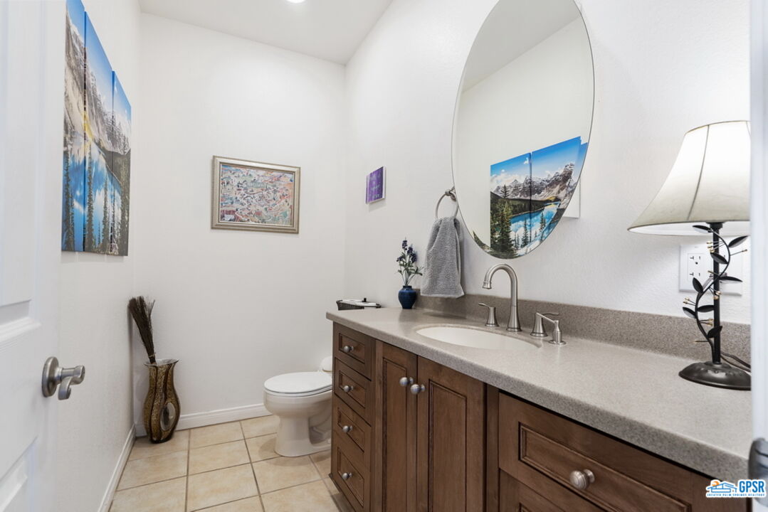 53305 Big Rock Drive Idyllwild, CA 92549 - Photo 29 of 67 a bathroom with a toilet sink and mirror