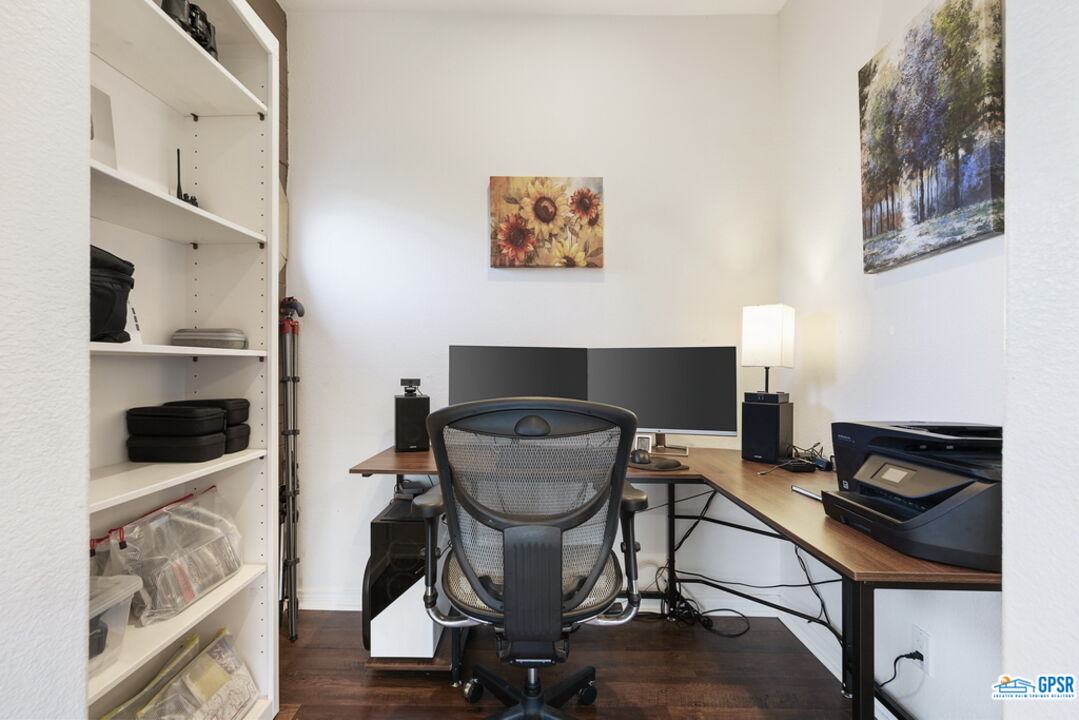 53305 Big Rock Drive Idyllwild, CA 92549 - Photo 34 of 67 a living room with a chair and potted plant on the wall