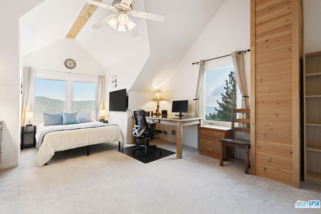 53305 Big Rock Drive Idyllwild, CA 92549 - Photo 39 of 67 a living room with furniture and a flat screen tv