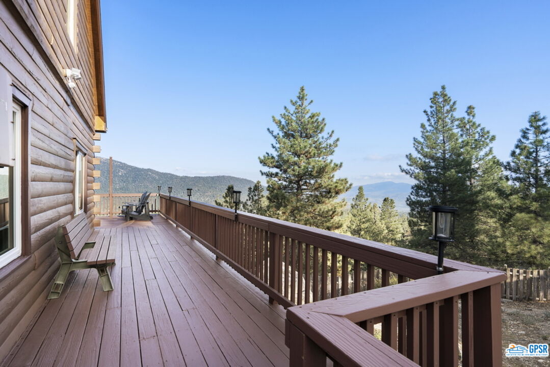 53305 Big Rock Drive Idyllwild, CA 92549 - Photo 46 of 67 a view of balcony with wooden floor and fence