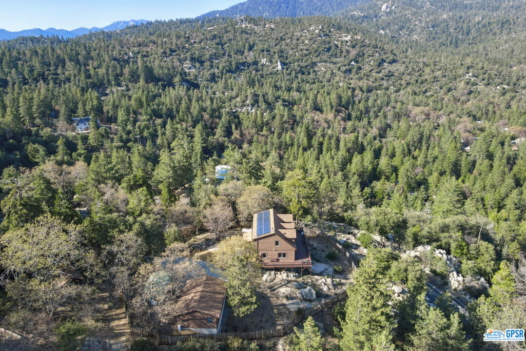 53305 Big Rock Drive Idyllwild, CA 92549 - Photo 65 of 67 a view of a city with lush green forest