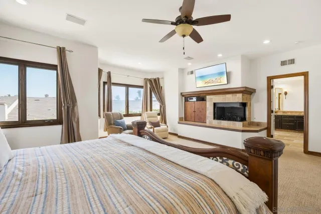 a bedroom with a bed and a fireplace