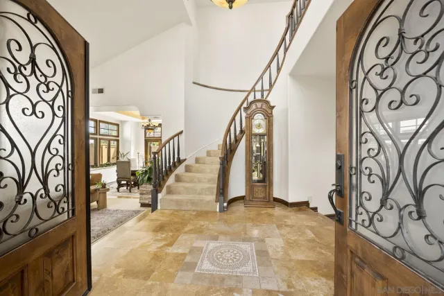 a view of entryway with stairs and wooden floor