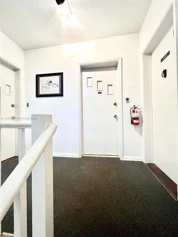 a view of hallway with livingroom