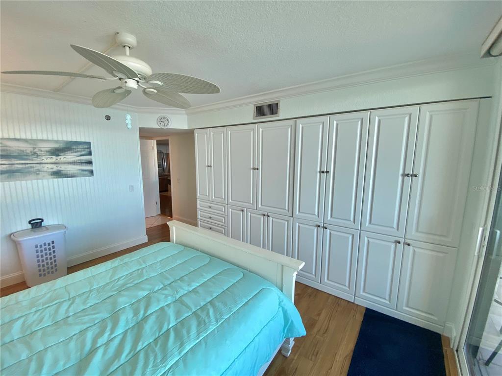 6035 Sea Ranch Drive, Unit 901 Hudson, FL 34667 - Photo 11 of 72 a bedroom with a bed and a window