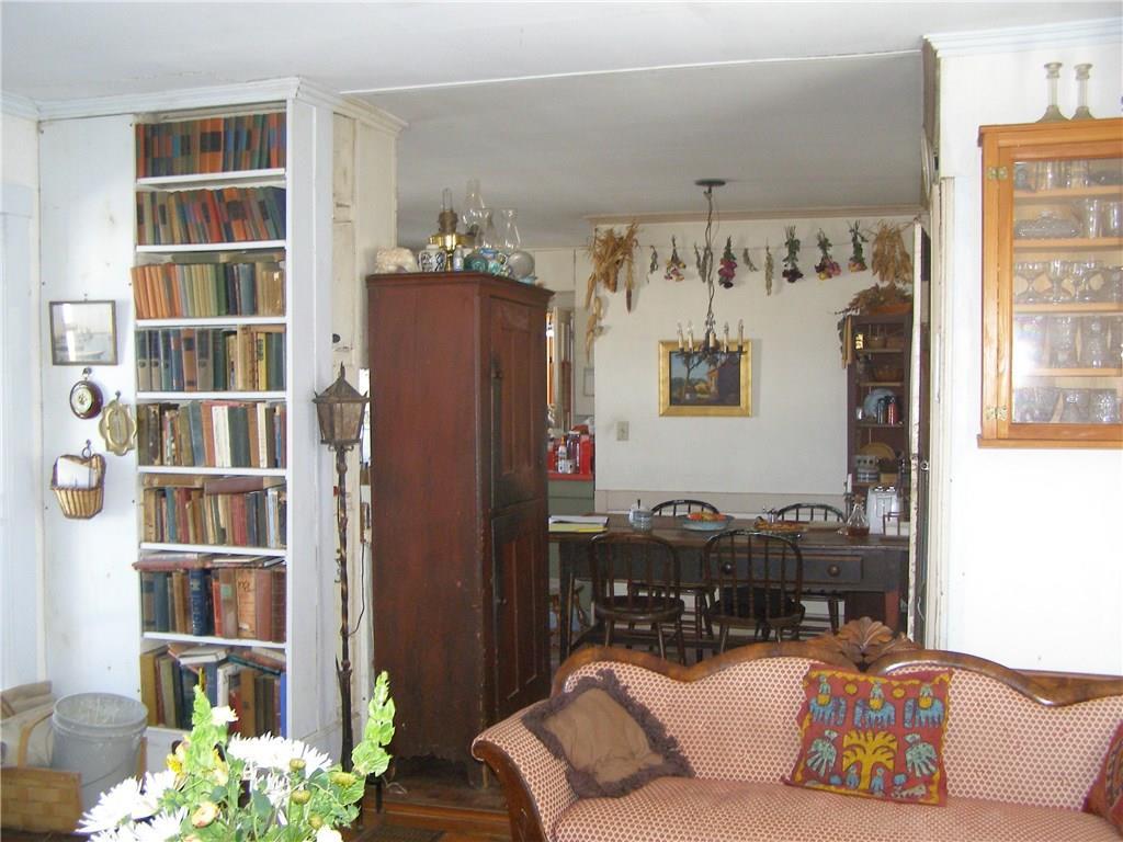 282 River Road Boothbay, ME 04537 - Photo 13 of 18 The dining area with bookcases and...