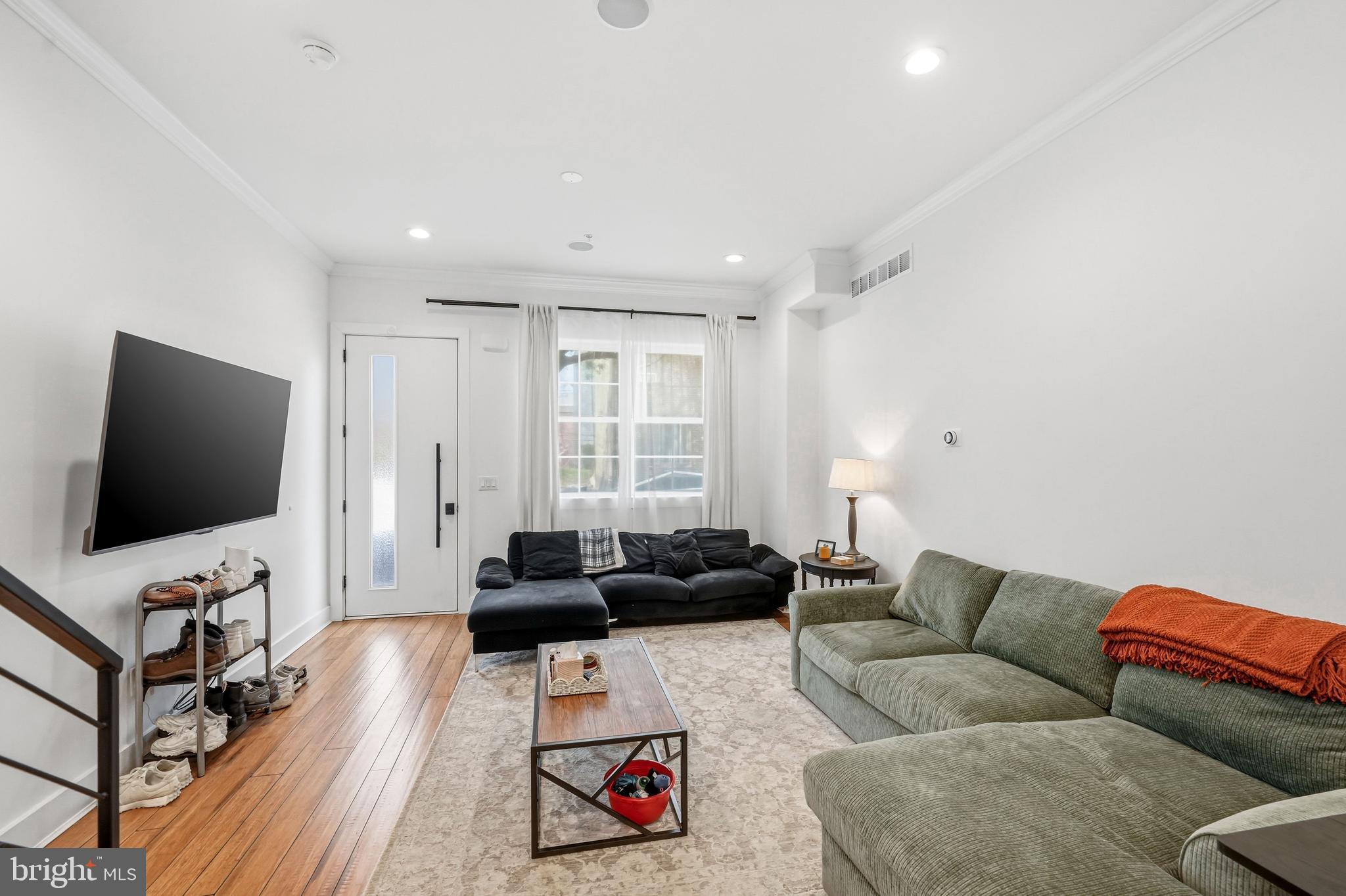 2604 Reed Street Philadelphia, PA 19146 - Photo 12 of 45 a living room with furniture and a flat screen tv
