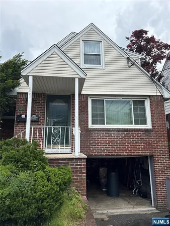a front view of a house with a garage