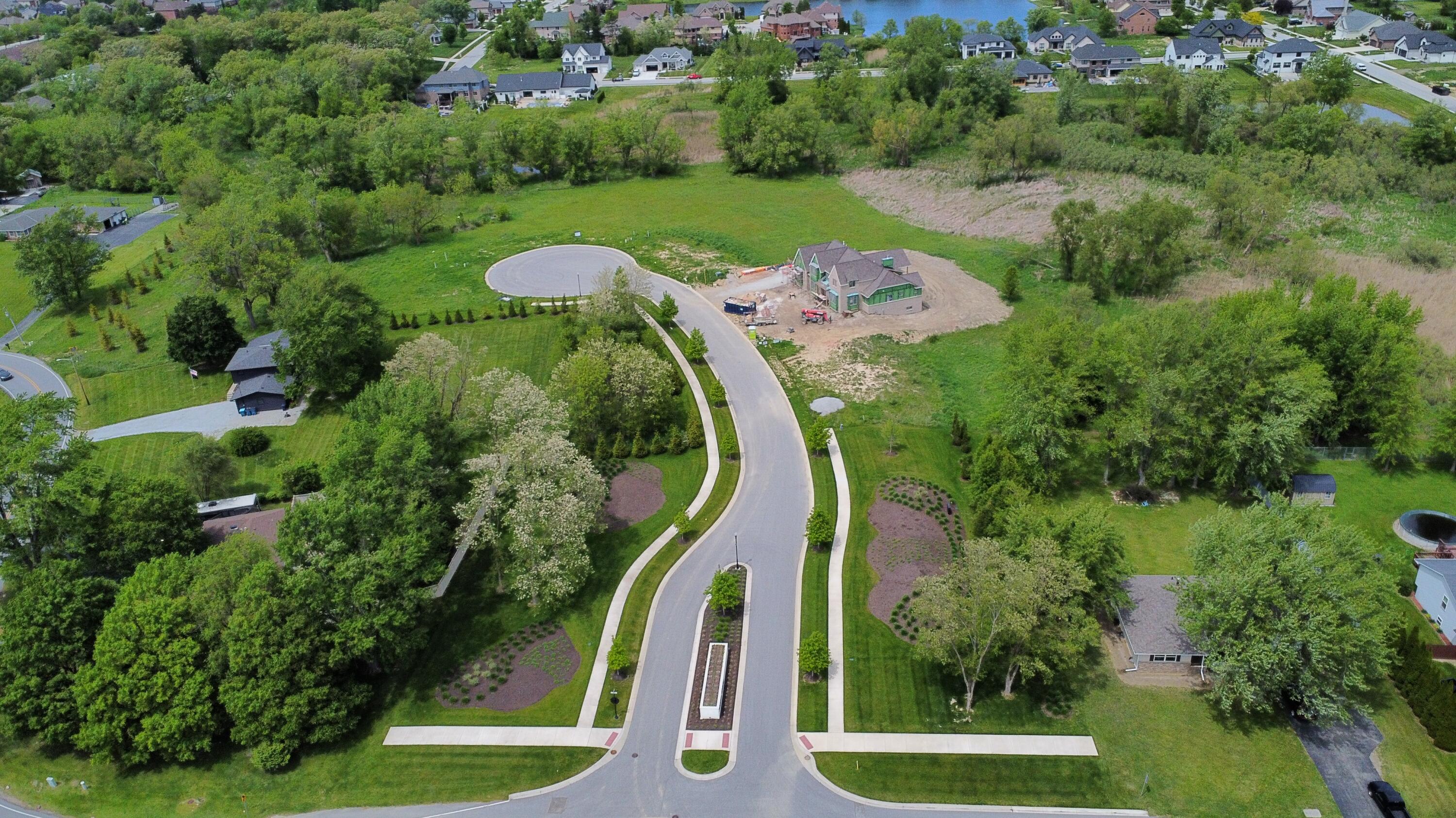 9245 Sublime Court St. John, IN 46373 - Photo 4 of 5 an aerial view of a golf course with swimming pool