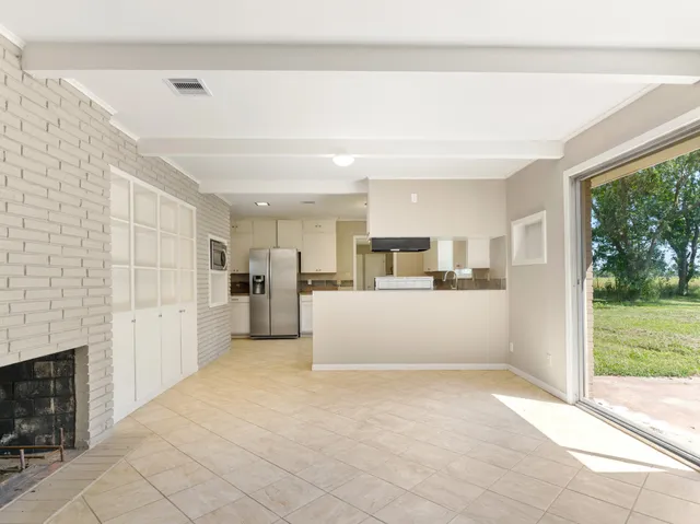 a view of a kitchen with a sink and dishwasher cabinets