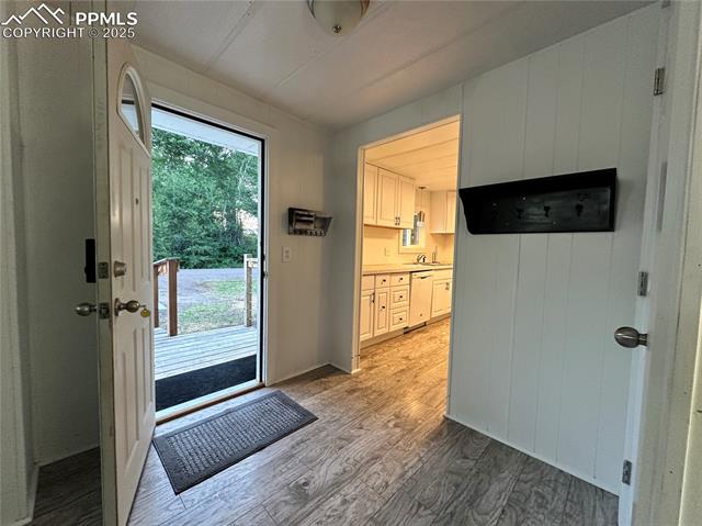 468 Rio Grande Road South Fork, CO 81154 - Photo 5 of 34 Entryway featuring laminate flooring and coat closet.