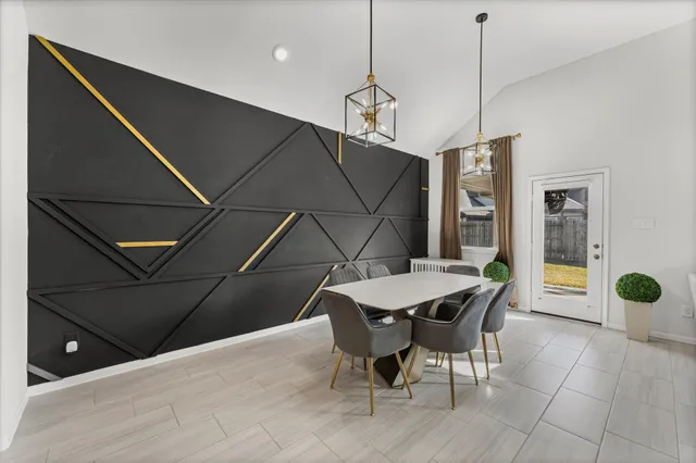 a dinning area with furniture and window