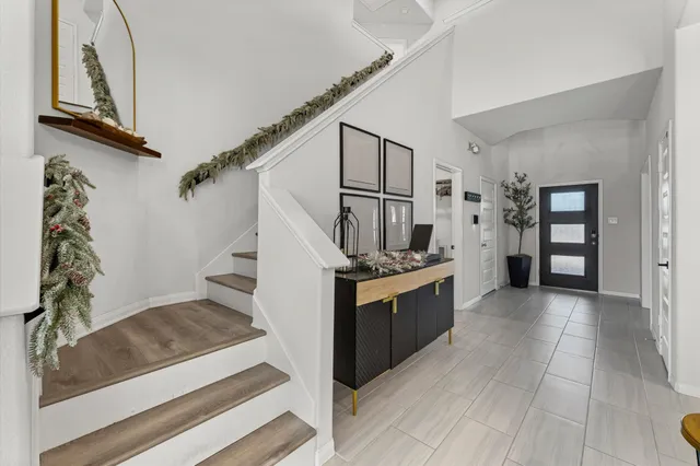 a view of a kitchen with furniture and staircase