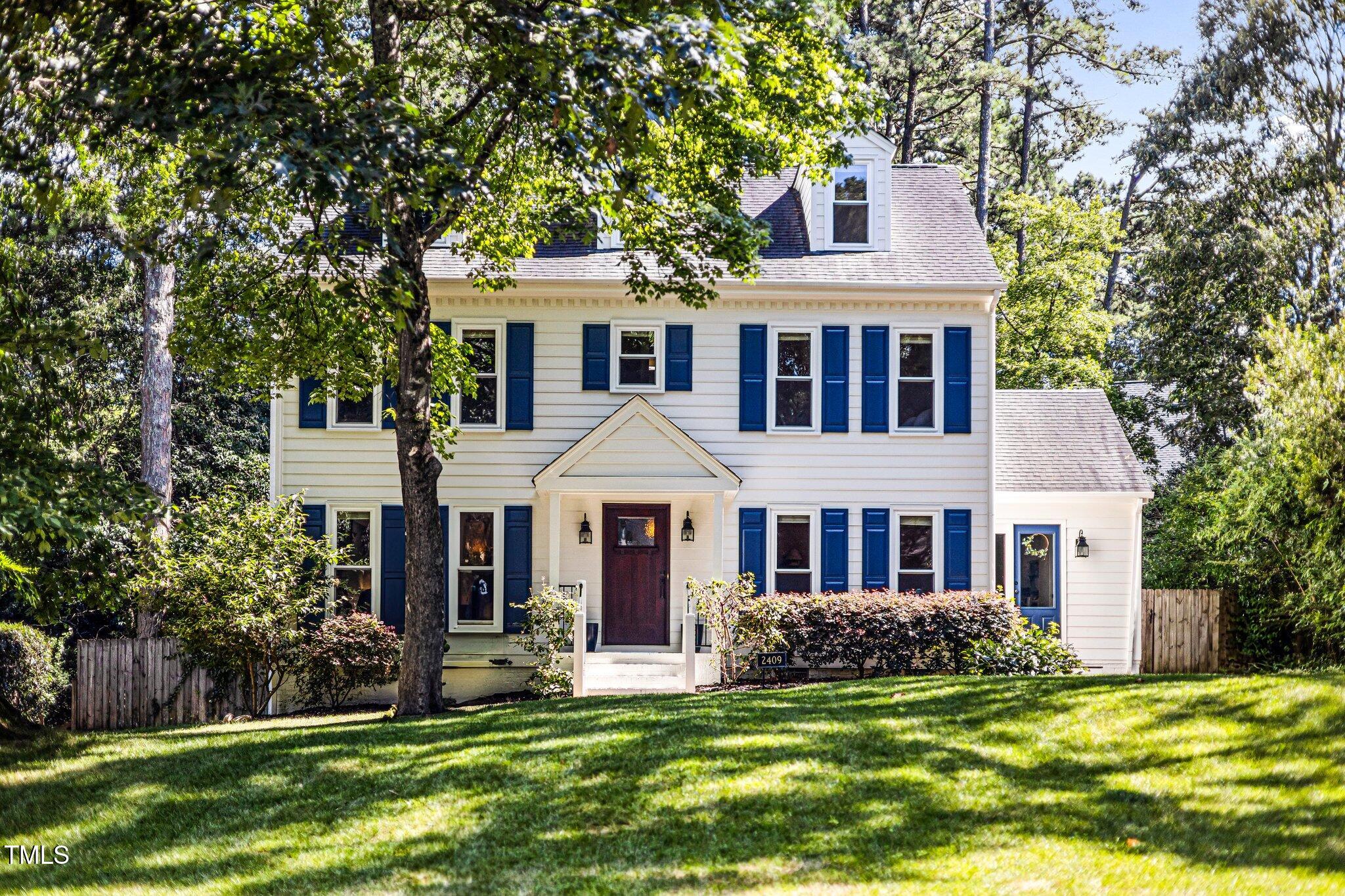 2409 Basil Drive Raleigh, NC 27612 - Photo 1 of 44 a front view of a house with a garden