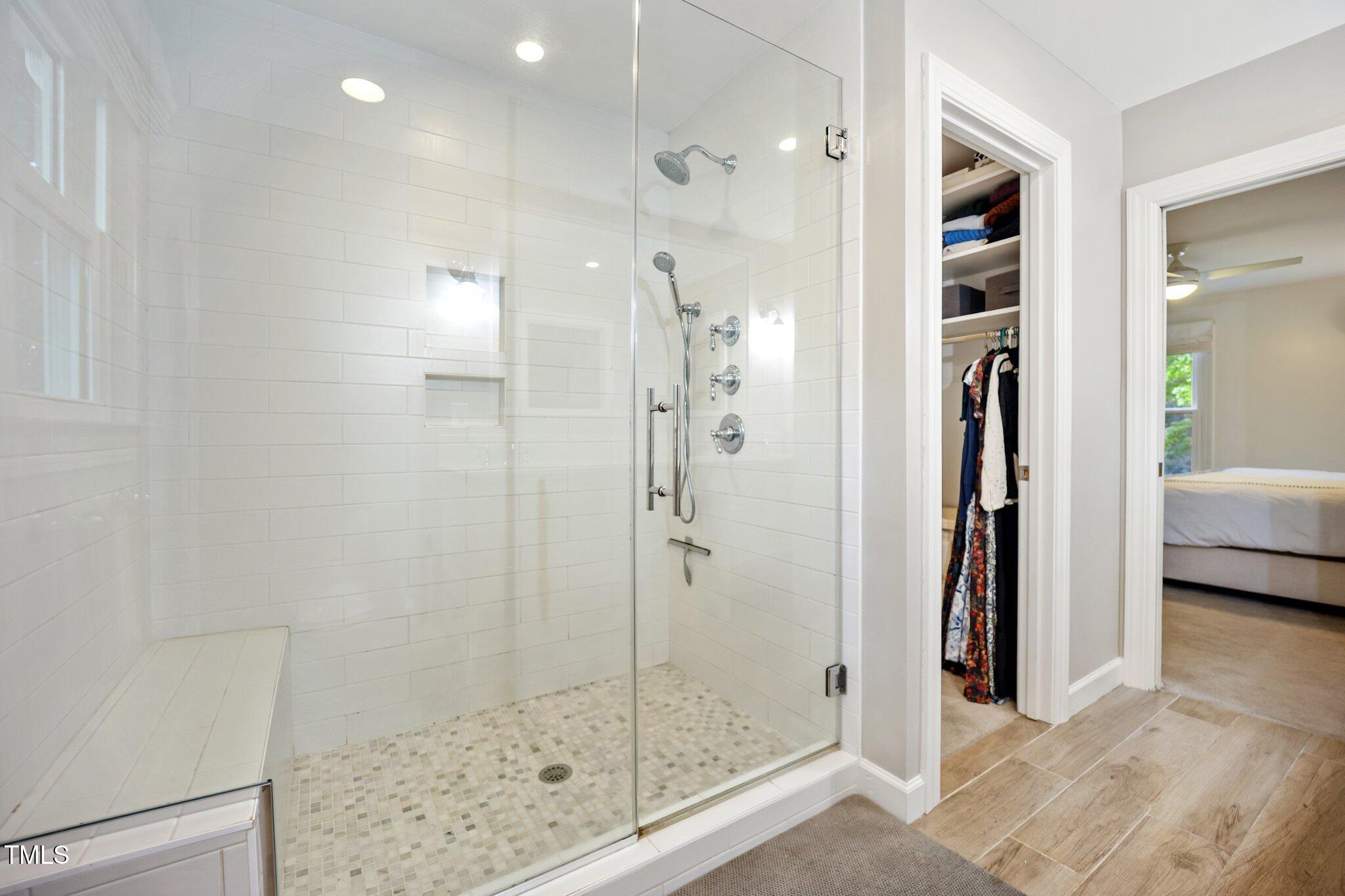 2409 Basil Drive Raleigh, NC 27612 - Photo 26 of 44 a bathroom with a shower and a sink