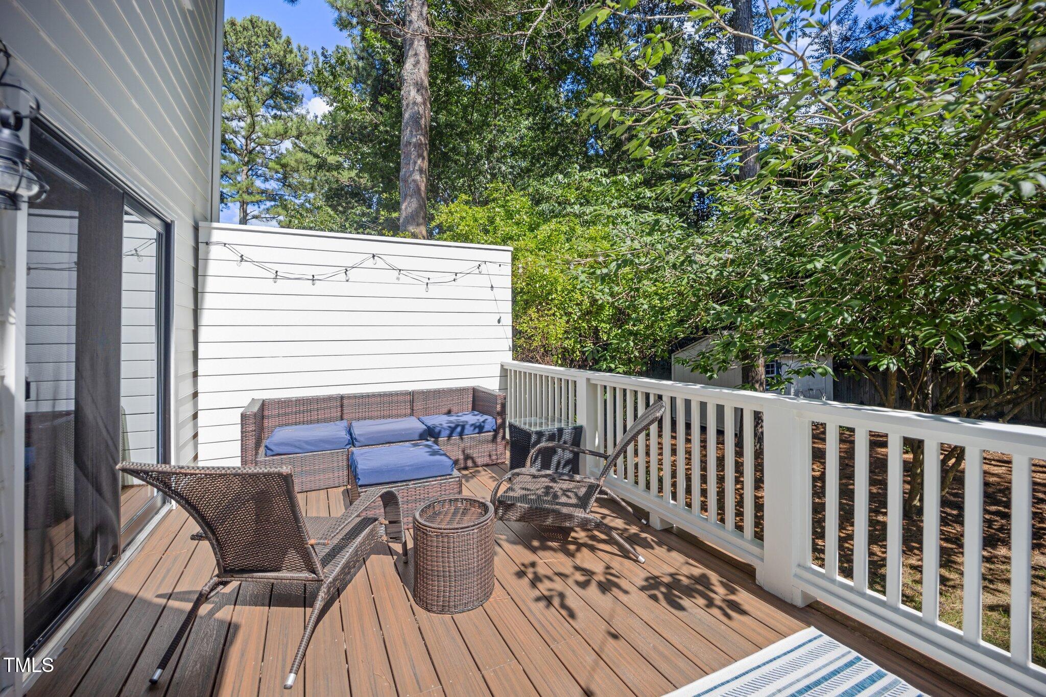 2409 Basil Drive Raleigh, NC 27612 - Photo 37 of 44 a view of balcony with furniture and wooden deck