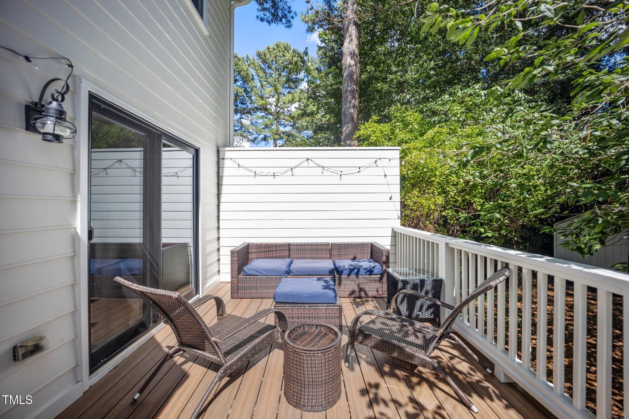 2409 Basil Drive Raleigh, NC 27612 - Photo 38 of 44 a view of balcony with two chairs and a table