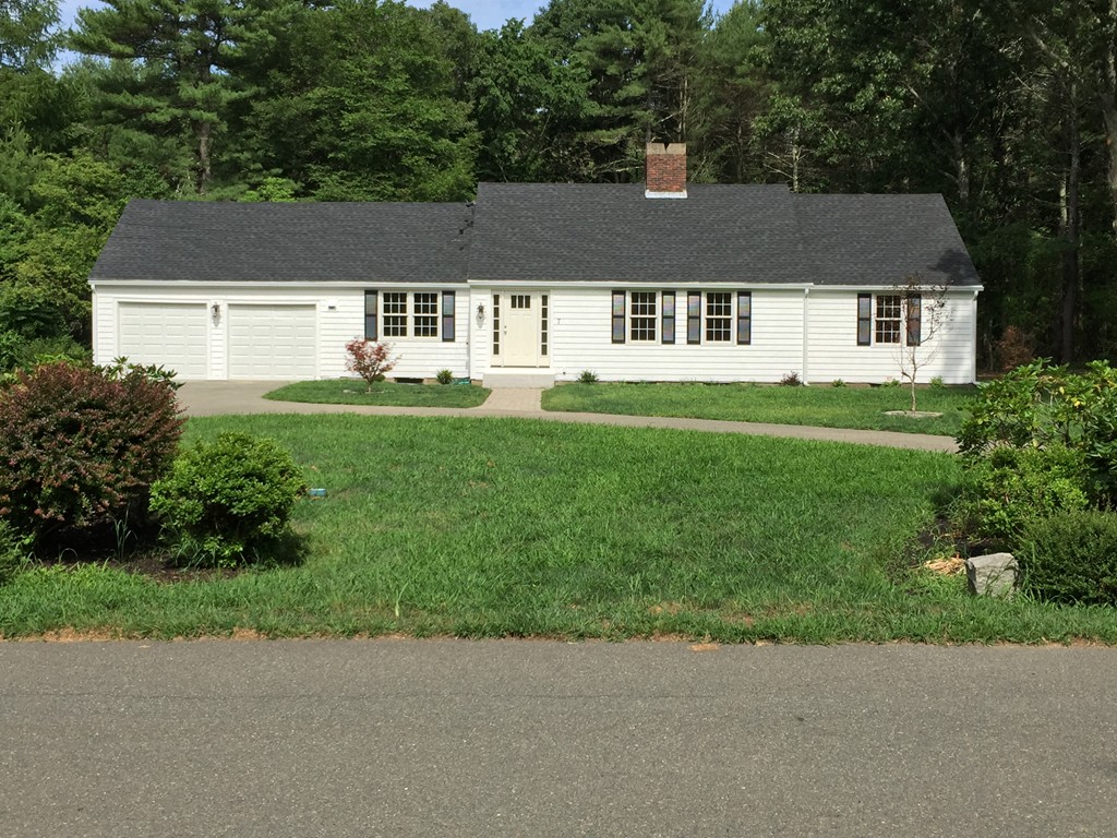 7 Chapman Road Boxford, MA 01921 - Photo 1 of 22 a aerial view of a house next to a yard