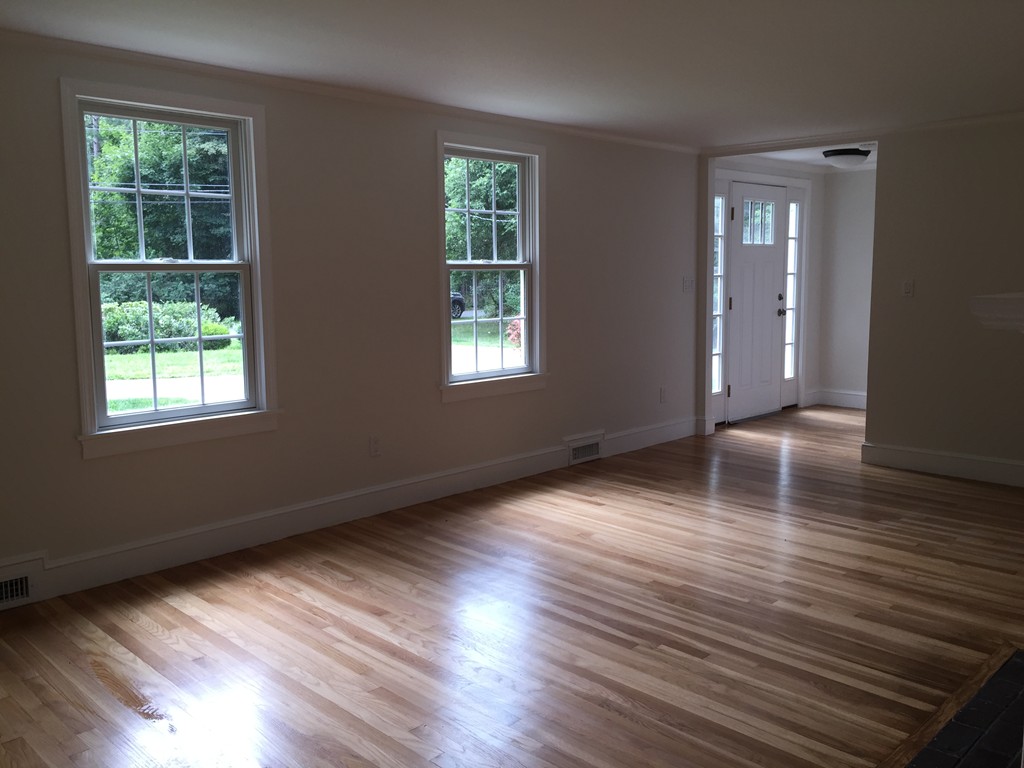 7 Chapman Road Boxford, MA 01921 - Photo 13 of 22 a view of a livingroom with wooden floor and window