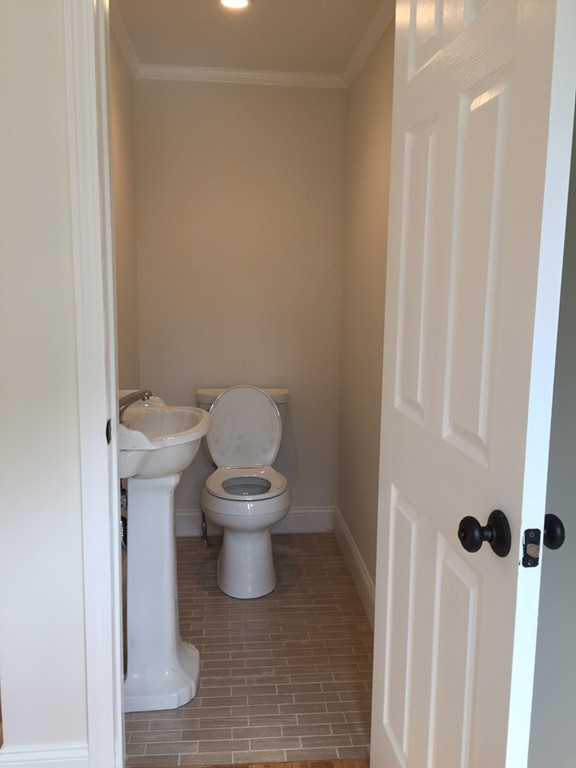 7 Chapman Road Boxford, MA 01921 - Photo 15 of 22 a white toilet sitting next to a white cabinet