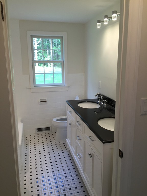 7 Chapman Road Boxford, MA 01921 - Photo 16 of 22 a bathroom with a sink a toilet and a window