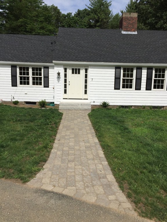 7 Chapman Road Boxford, MA 01921 - Photo 2 of 22 a front view of a house with a yard