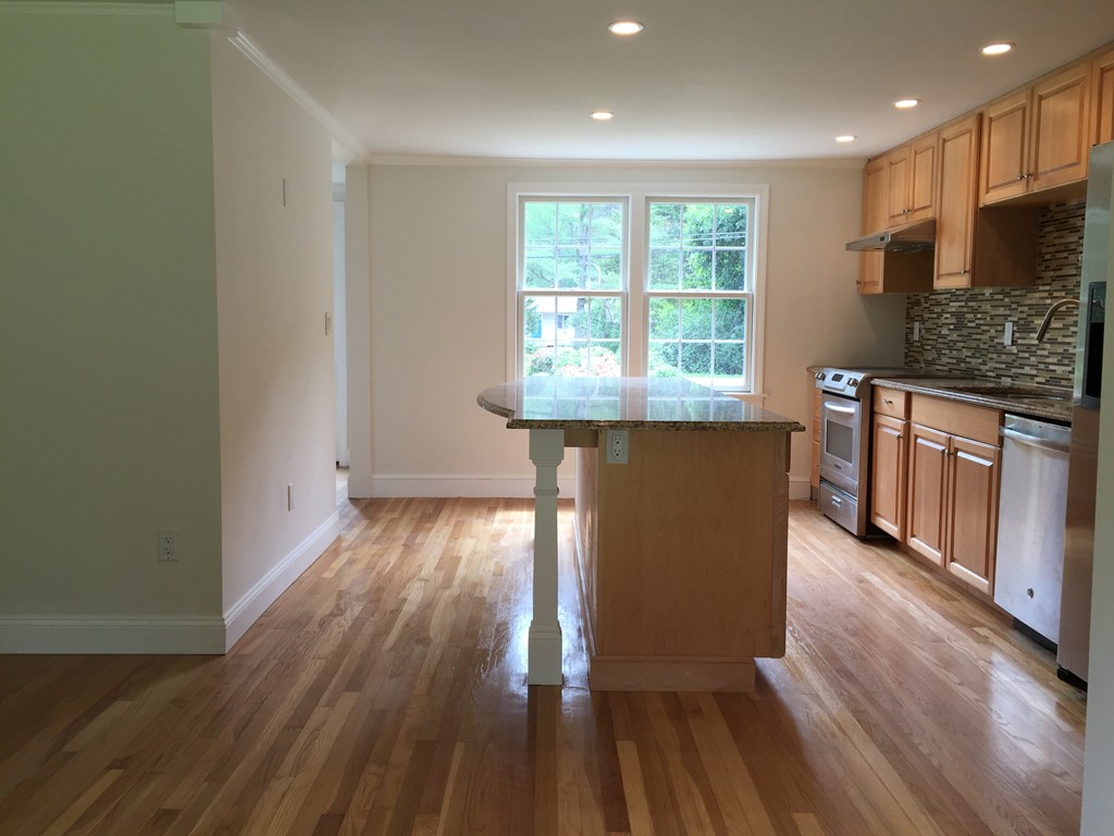 7 Chapman Road Boxford, MA 01921 - Photo 5 of 22 an empty room with wooden floor and a window