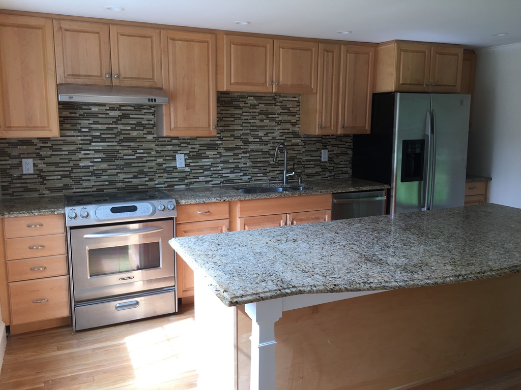 7 Chapman Road Boxford, MA 01921 - Photo 6 of 22 a kitchen with granite countertop a stove and cabinets