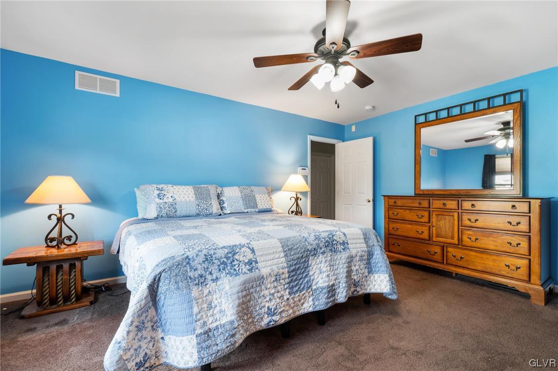 1206 Shiloh Road Allentown, PA 18106 - Photo 19 of 28 a bedroom with a bed and a dresser in it