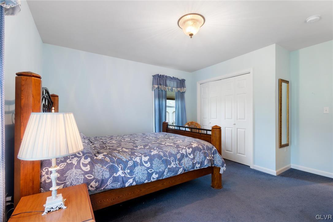 1206 Shiloh Road Allentown, PA 18106 - Photo 23 of 28 a bedroom with a bed and a night stand