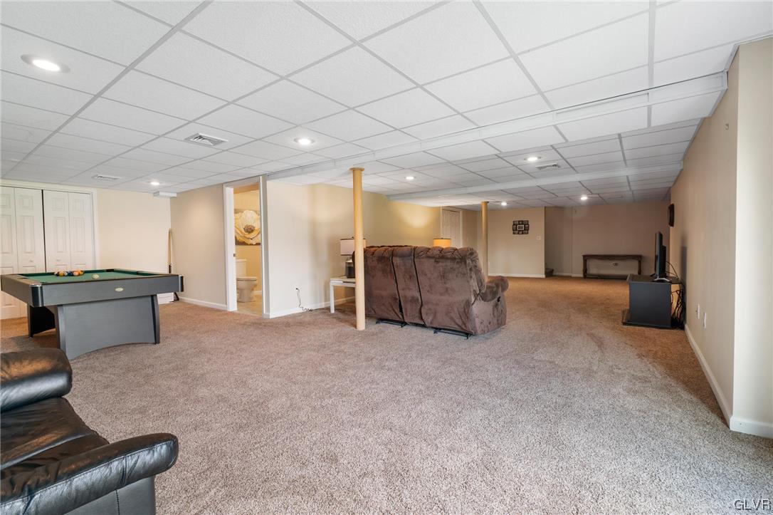 1206 Shiloh Road Allentown, PA 18106 - Photo 25 of 28 a living room with furniture and a chandelier