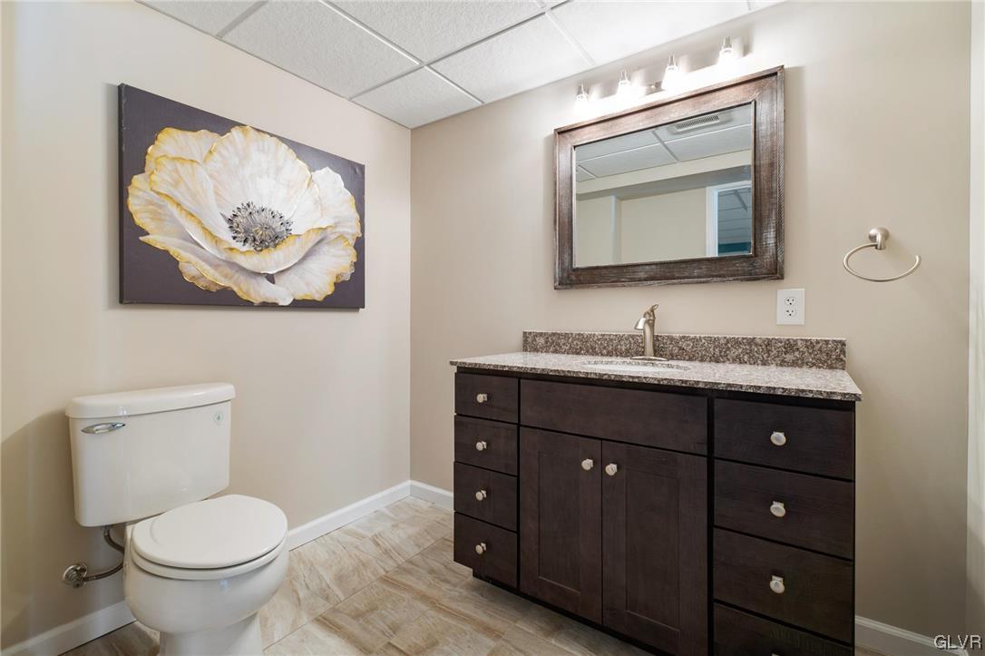1206 Shiloh Road Allentown, PA 18106 - Photo 28 of 28 a bathroom with a toilet a sink and mirror