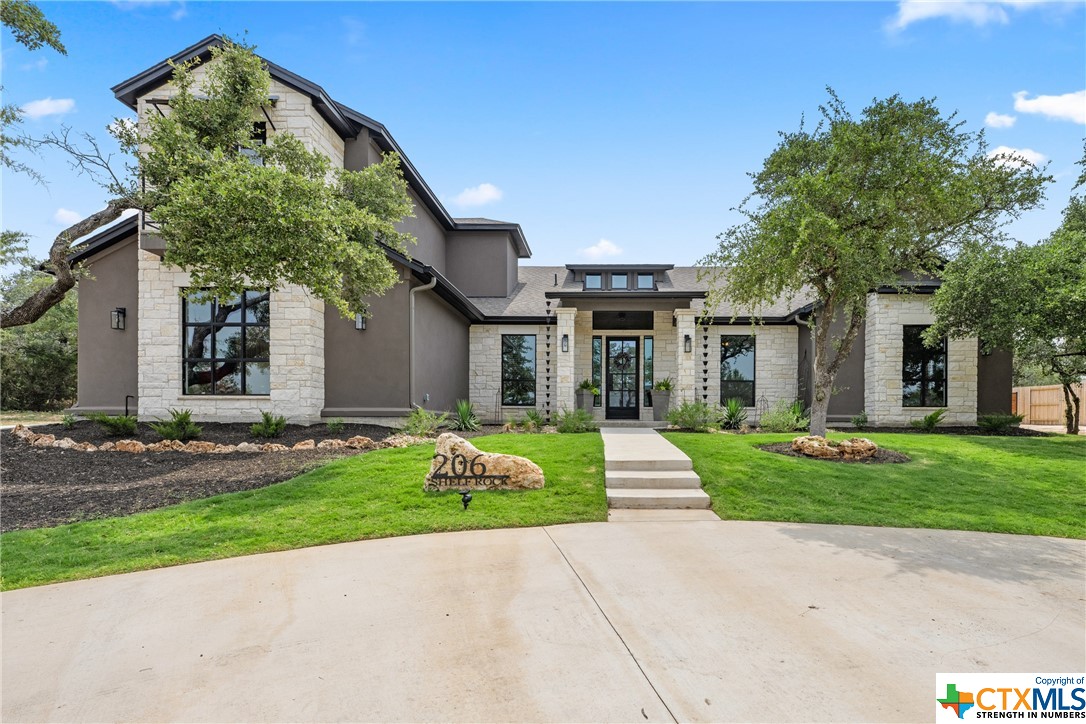 front view of a house with a yard