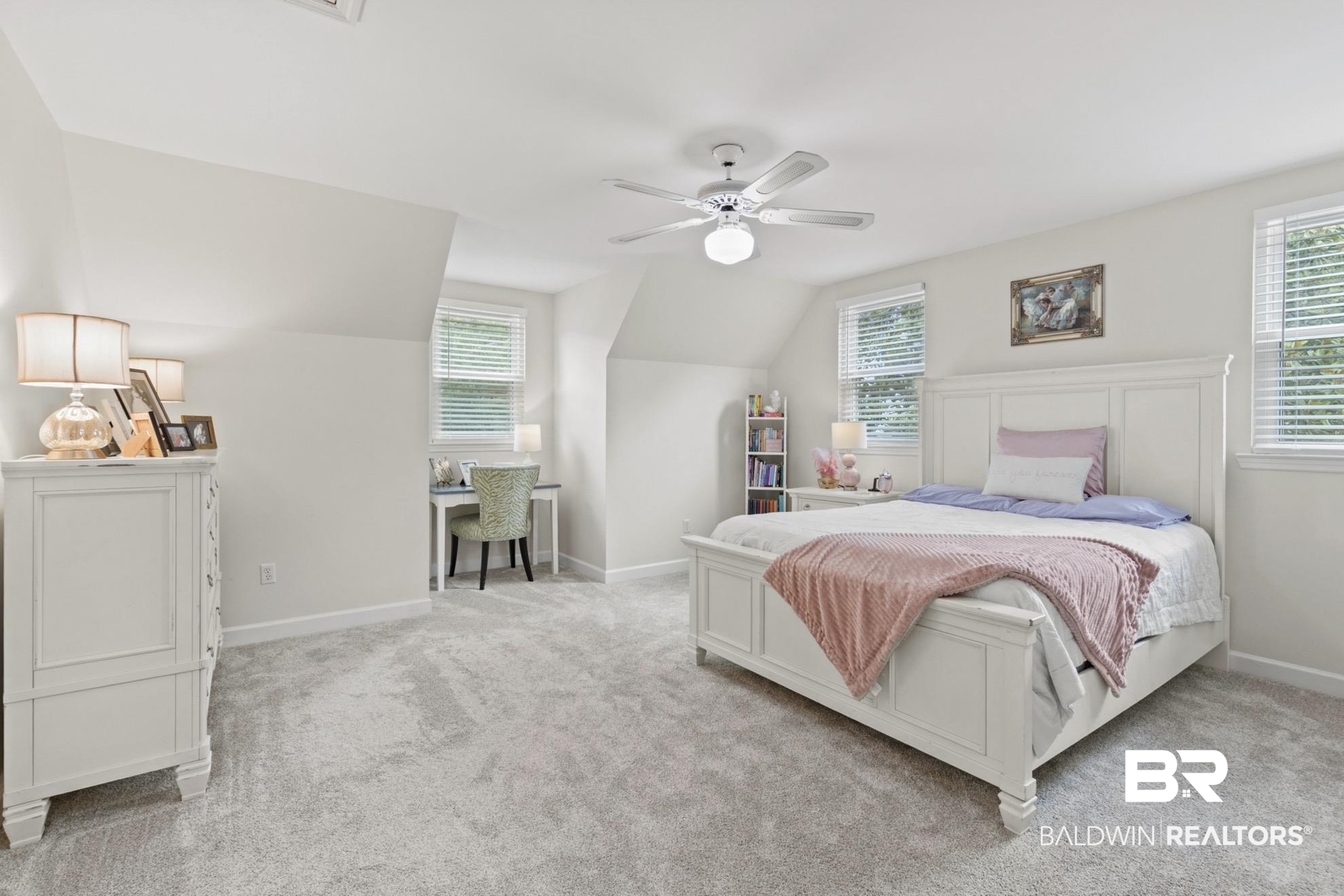 12171 Marguerite Drive Coden, AL 36523 - Photo 16 of 44 Spacious bedroom with light gray carpeting, neutral wall finishes, and a ceiling fan with integrated lighting