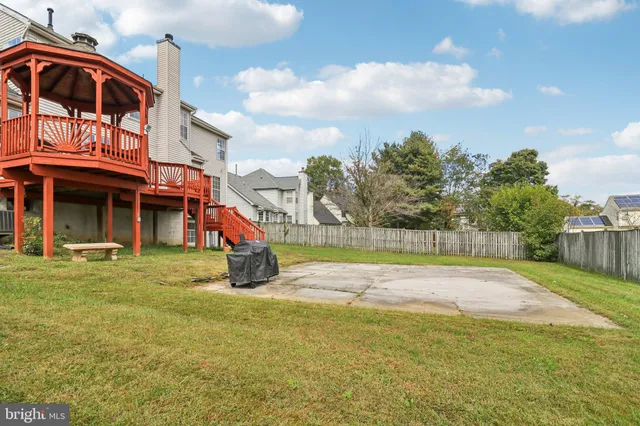a view of a house with a yard and slide