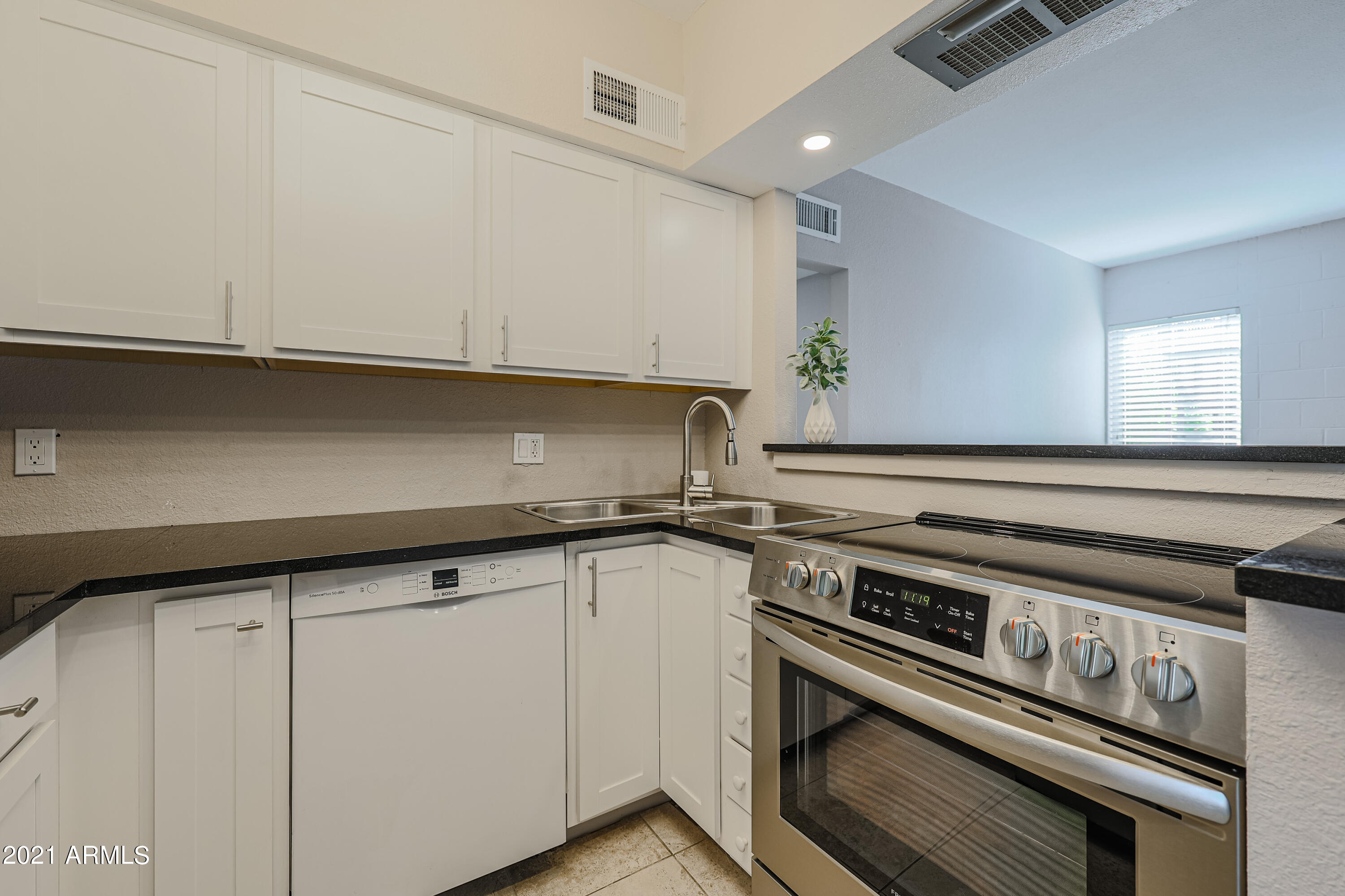 4041 East Camelback Road, Unit 3 Phoenix, AZ 85018 - Photo 13 of 22 White cabinets