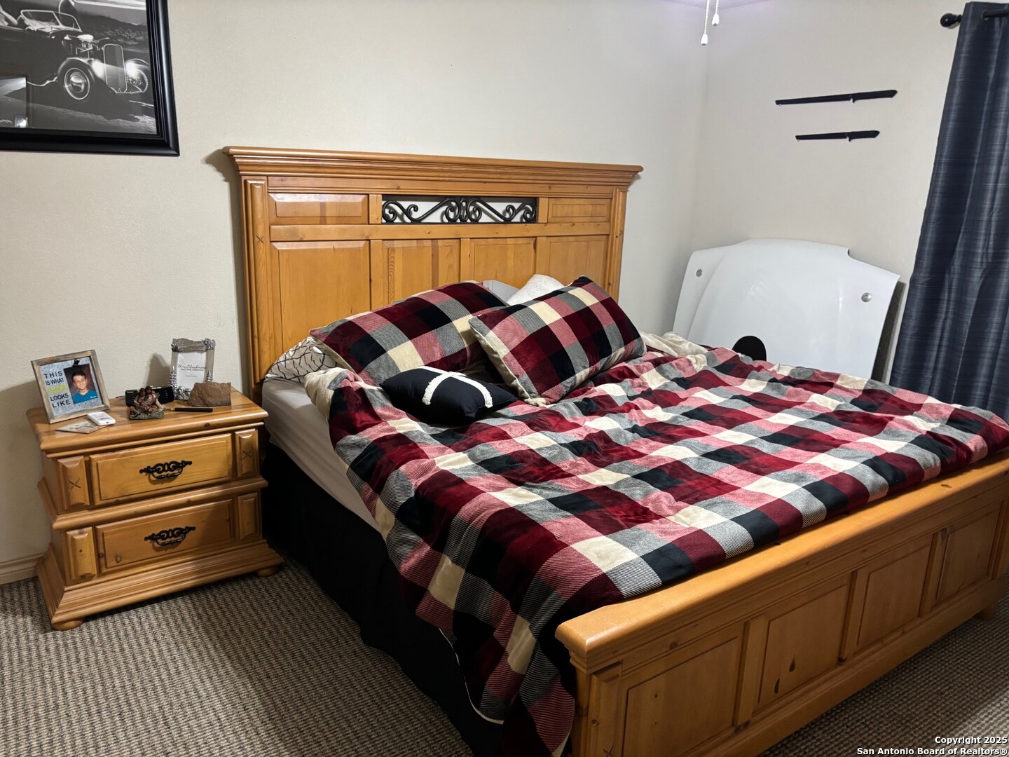 952 Madrona Road Pipe Creek, TX 78063 - Photo 11 of 33 a bedroom with a bed and dresser