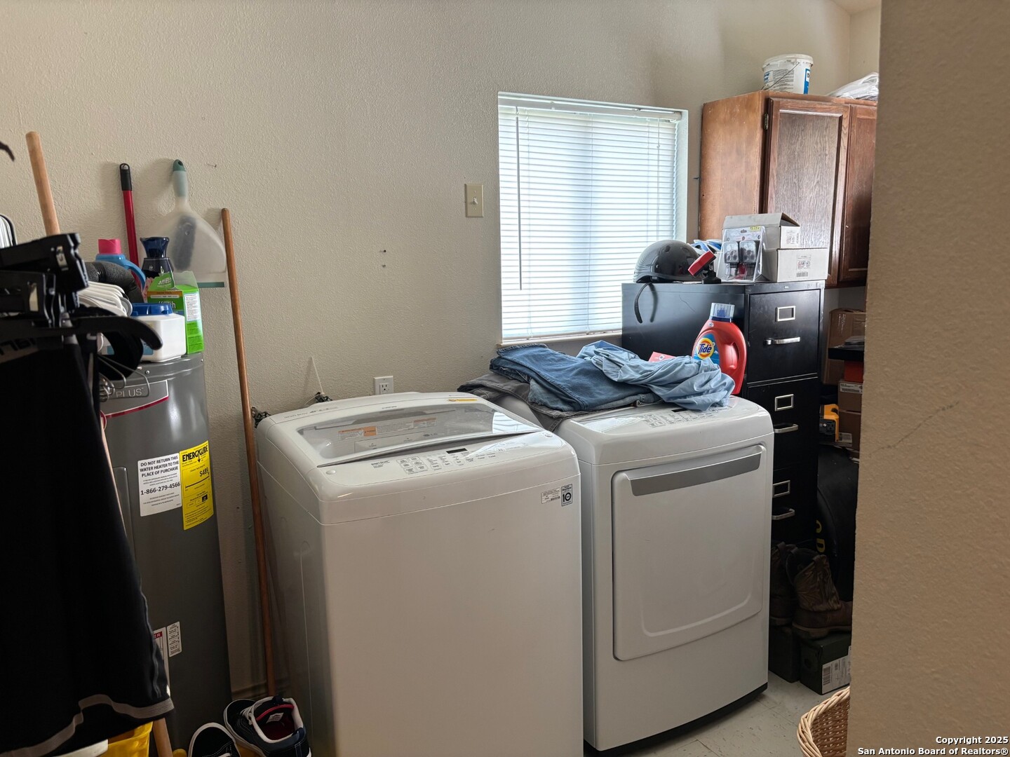 952 Madrona Road Pipe Creek, TX 78063 - Photo 15 of 33 a storage room with washer and dryer