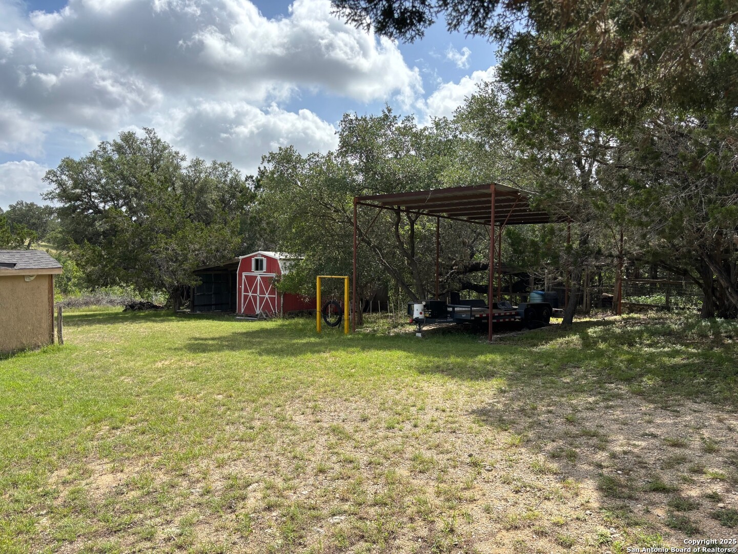 952 Madrona Road Pipe Creek, TX 78063 - Photo 30 of 33 a front view of a house with garden