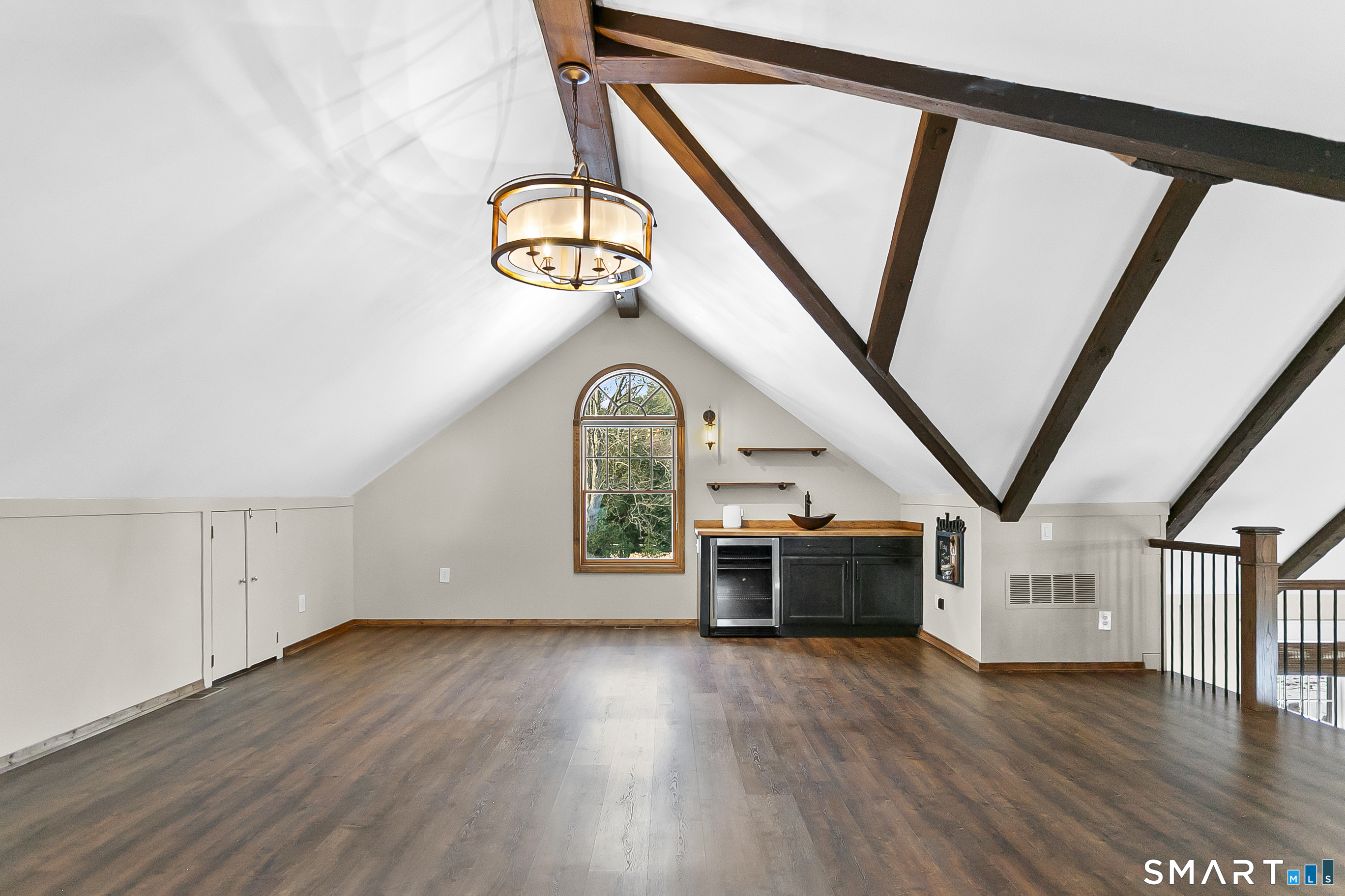 158 Coventry Lane Fairfield, CT 06824 - Photo 21 of 39 Loft accessible from family room with wet bar, bev fridge and entertainment/tv area