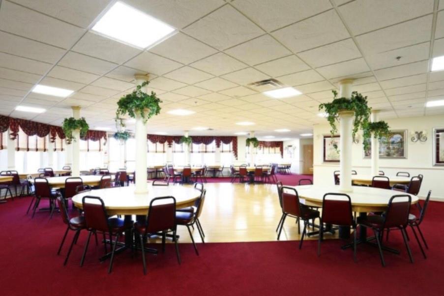 242 Adams Pointe Boulevard, Unit 3 Mars, PA 16046 - Photo 16 of 19 a view of a dining room with furniture and chandelier